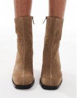 heeled leather ankle boot in tan suede