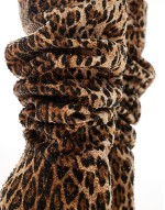 Adventurous over the knee boots in embellished leopard