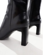 Reach set back mid heel boots in black